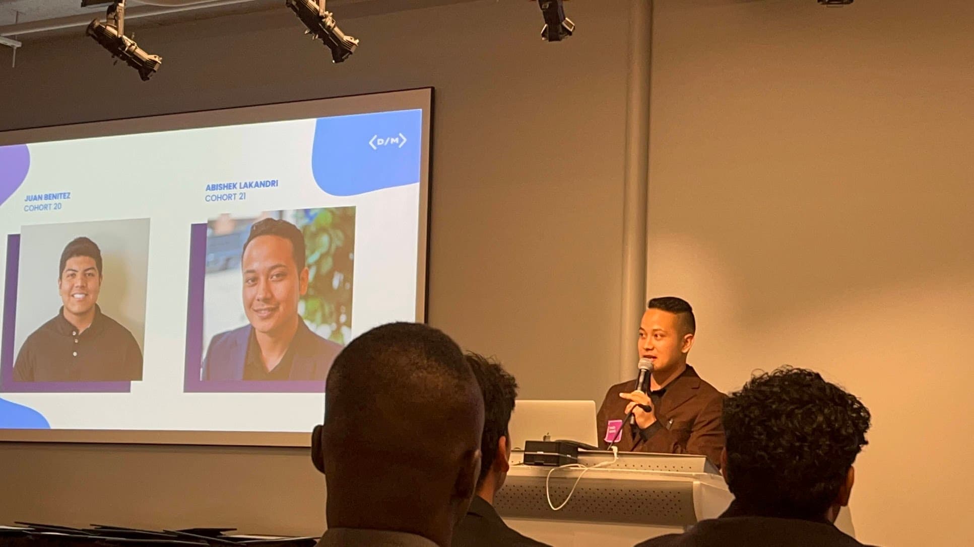 Abishek presenting on stage